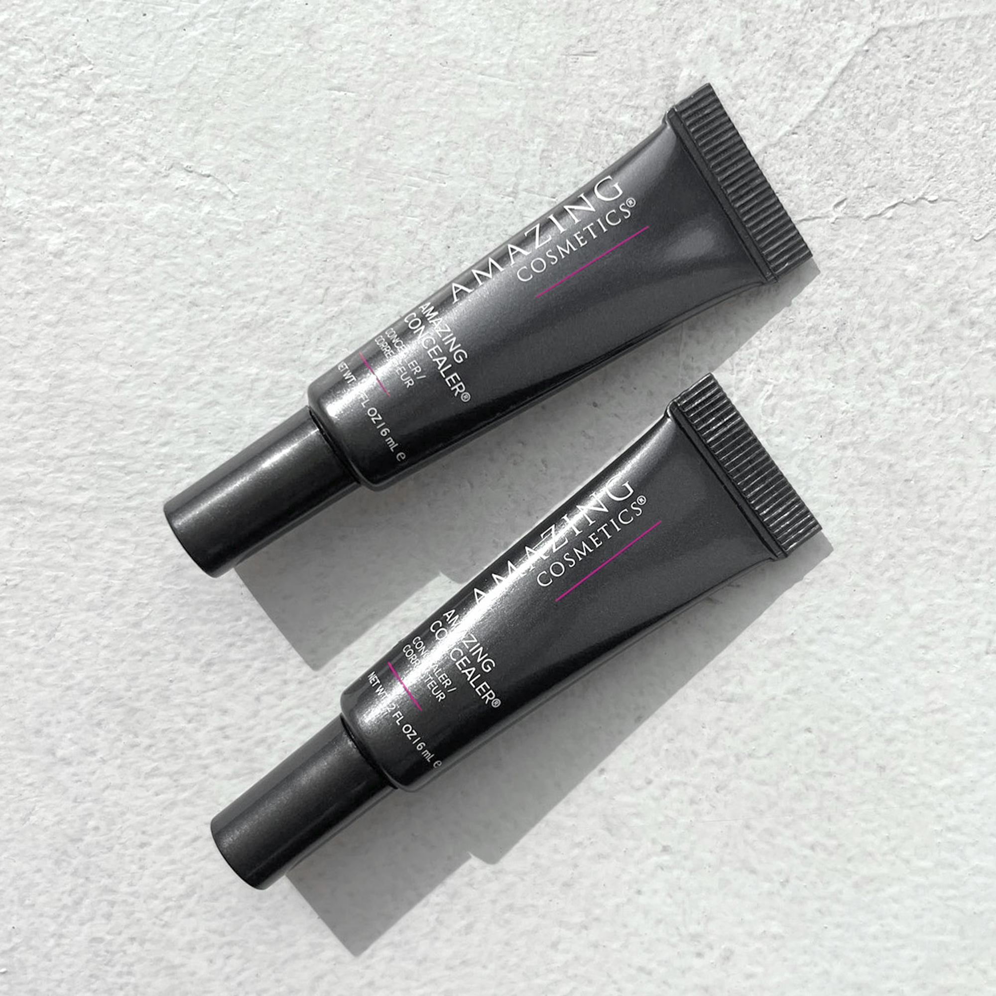 AMAZINGCONCEALER full-coverage cream concealer tube designed to be compact and travel-friendly for on-the-go touch-ups.