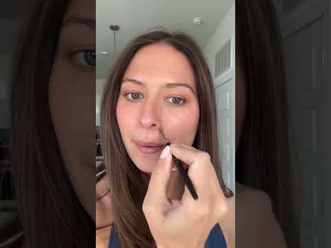 Model applying AMAZINGCONCEALER over blemishes, redness and dark circles using it to spot correct.