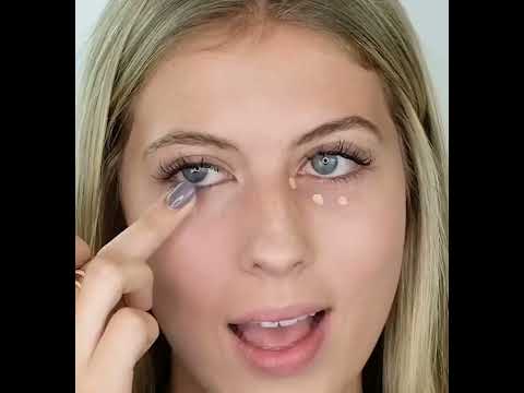 Model applying AMAZINGCONCEALER under her eyes to hide dark circles. 