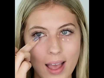 Model applying AMAZINGCONCEALER under her eyes to hide dark circles. 